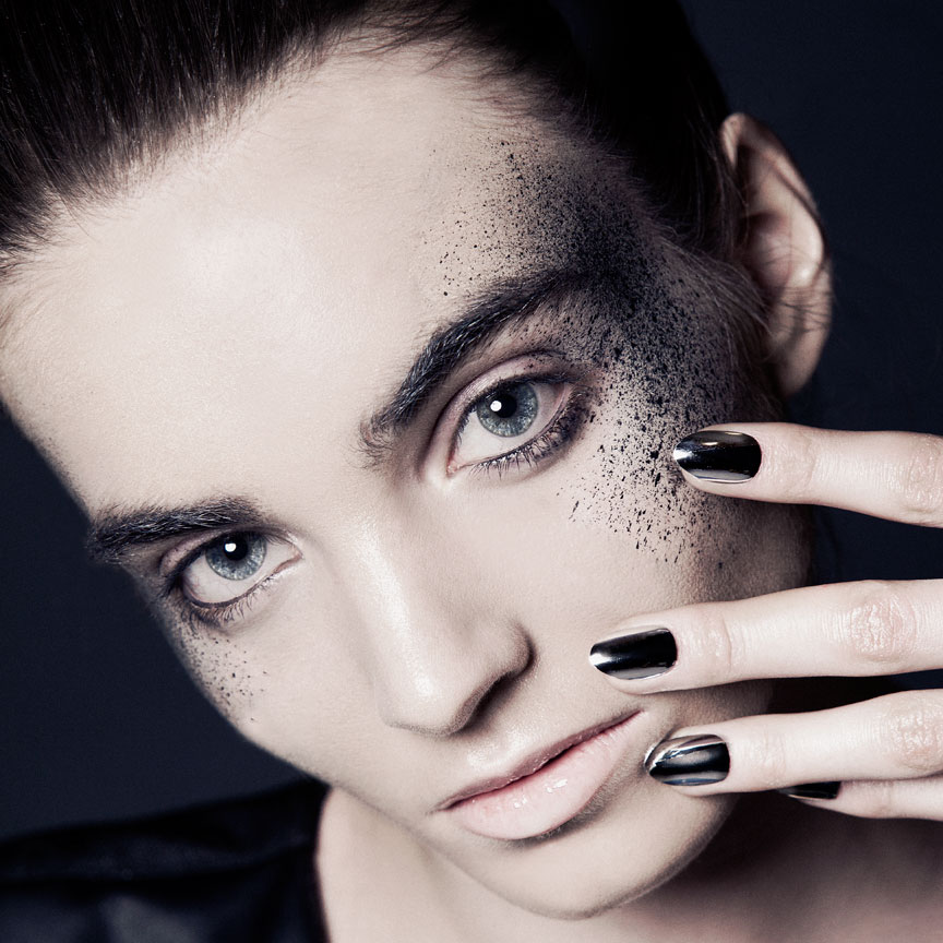 dark beauty photography with chrome nails
