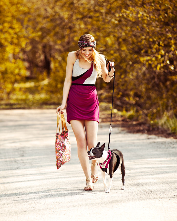 Girl walking Boston Terrier Dog
