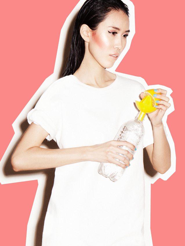 Girl squeezing a lemon 