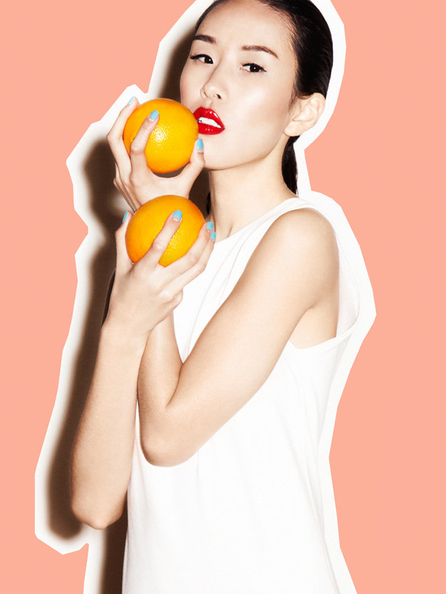 Asian Girl with Oranges
