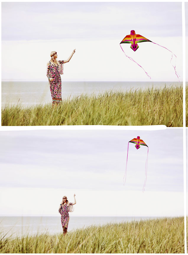 Girl flying kite on beach