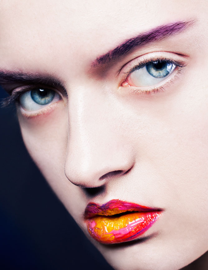 Colorful macro beauty with a focus on multicolored lipstick