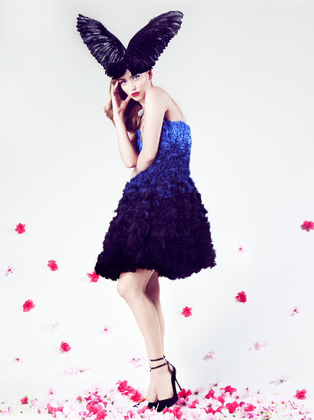 model in ombre floral dress with wing hat